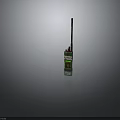 Green Walkie Talkie With Long Antenna And Control Buttons On Dark Background