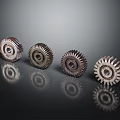 Industrial Hardware Tools Set of Four Metal Gears on Dark Reflective Background