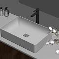 White Rectangular Washbasin On Marble Countertop With Wooden Cabinet And Flower Vase