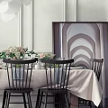 Elegant Dining Table Set With Black Chairs Tablecloth And Flower Centerpieces