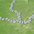 Gray Stone Garden Path Paving Winding Through Green Grass Forming Natural Walkway