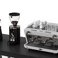 Daily Electrical Appliances Including Coffee Machine And Grinder On Black Kitchen Countertop