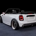 White Mini Convertible Car With Red Side Mirrors And Black Alloy Wheels