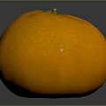 Fresh Ripe Orange Fruit with Smooth Textured Skin Green Stem on Black Reflective Surface