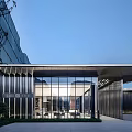 Modern Building Facade With Glass Curtain Wall Metal Frame And Entrance Lighting Design