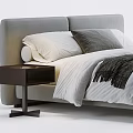 Modern Double Bed with Gray Headboard White Gray Pillows and Black Throw Blanket