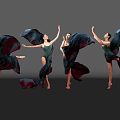 Women Dancing in Green Leotards with Flowing Black Fabric on Grey Background