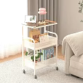 Warm Living Room With White Rolling Cart Tablet Desserts Pink Lamp Books And Green Plant
