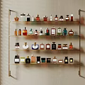 Elegant Wall Mounted Shelf With Various Perfume And Cosmetic Bottles