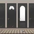 Black Hinged Doors with Arched Glass Circular Window Vent and Golden Handles on White Walls