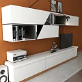 Modern White TV Stand Against Yellow Wall With TV And Decorative Shelves