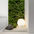 Green Wall Design With White Louvered Panels Stone Small Plants And Round Light