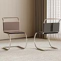 Modern Dining Chairs With Metal Frame And Brown Black Upholstered Seats In Minimalist Room