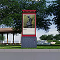 Outdoor Billboard Featuring Sculpture Painting In Park With Green Trees And Grass