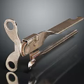 Metal Clamp Tool With Gear Mechanism And Two Holes On Black Surface