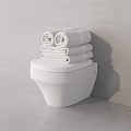 White Modern Toilet With Stacked Towels In Minimalist Bathroom Setting