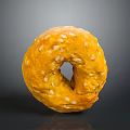 Freshly Baked Golden Sesame Seed Bagel With Shiny Surface On Dark Background