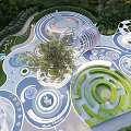 Interactive Children's Play Area With Circular Maze Elephant Figures And Green Spaces