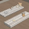 White Long Cushions With Decorative Shells Flower Ornaments And Small Pillows On Wooden Floor