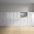 White Bookcase With Green Handles Glass Doors Holding Books And Decorative Items In Bright Interior
