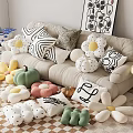 Decorative Pillows With Flower Shapes And Geometric Patterns In Living Room On Sofa And Floor