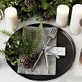 Festive Tableware Set With Evergreen Greenery Pine Cones White Candles And Wine Glasses