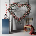 Heart Shaped Floral Art Display With Pink Flowers Greenery Blue Pedestal Lanterns And Wooden Chair