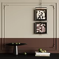 Beige And Brown Wall With Two Framed Abstract Artworks And Black Table With Green Fruits