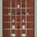Tea Set Display on Illuminated Multi Tiered Shelves with Teapots Teacups Red Boxes and Books