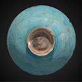 Turquoise Ceramic Bowl Featuring Intricate Decorative Patterns And Light Colored Base