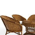 Woven Rattan Outdoor Table Set With Matching Chairs And White Cushions