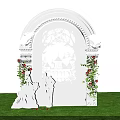 White Arched Event Entrance With Intricate Cut Out Patterns Castle Design And Wing Decorations