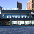 Modern Sales Office Building In Commercial District With Glass Curtain Walls And High Rise Background