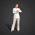 Woman Wearing White Suit Standing with Hands Crossed Against Gray Background