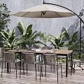 Outdoor Wooden Dining Table And Chairs With Patio Umbrella And Green Plants