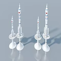 Three White Rocket Models With Blue Stripes And Red Logos On White Bases With Shadows