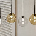 Four Spherical Pendant Lights Transparent And Gold Hanging With Blinds And Light Colored Walls