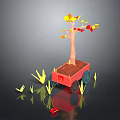 Tree with Yellow and Red Leaves in Red Cart Surrounded by Green Grass