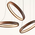 Modern Wooden Ring Pendant Lights With LED Glow Hanging In Contemporary Space