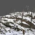 Beautiful Winter Landscape With Snow Covered Rocks And Bare Trees In Nature