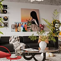 Contemporary Living Room Interior Featuring Black Sofa Coffee Table Red Rocking Chair And Wall Painting