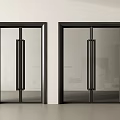 Modern Double Glass Doors with Black Frame and Long Handles in Minimalist Interior Setting