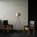 Black Leather Leisure Chairs With Wooden Frames And Tripod Floor Lamp In Indoor Space
