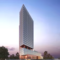 Modern Tall Office Building With Glass Facade Set Against Evening Sky And Green Trees