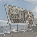 Clothes Rack On Balcony With Hanging Clothes Cartoon Patterned Cloth And Small Stuffed Toy