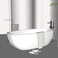 White Freestanding Bathtub in Beige Bathroom with Towel Slippers and Bamboo Plant