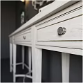 White Dressing Table With Circular Decorative Mirror Wall Lamps Candlesticks Books And Photo Frames