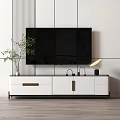 Modern White And Black TV Stand With Flat Screen TV Potted Plant And Table Lamp