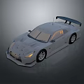 Gray Sports Car With Rear Spoiler And Sleek Design