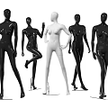 Black and white female mannequins in various standing poses for retail